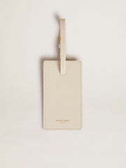 Worn white luggage tag