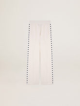 Women’s white joggers with stars on the sides