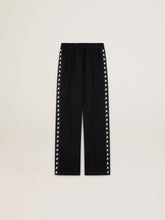 Women’s black joggers with white stars on the sides