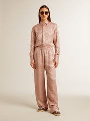Women's pink viscose pants with floral pattern