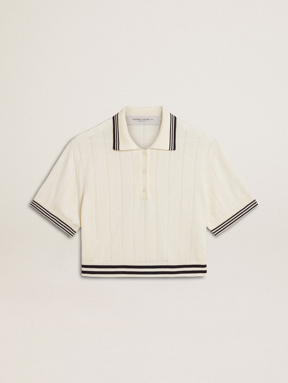 Women's cropped worn-white cotton polo shirt with blue ribbing