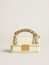 Small Venezia Bag in butter-colored boarded leather with braided scarf and double charm