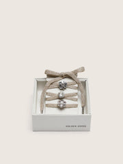 Skins braided gold-colored laces with shimmering charms