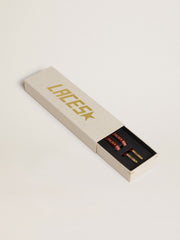 Burgundy cotton laces with contrasting gold-colored logo