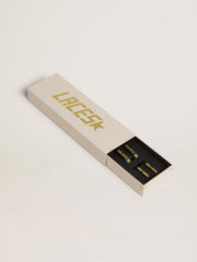 Dark green cotton laces with contrasting gold-colored logo