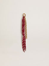 Charm with red knotted laces