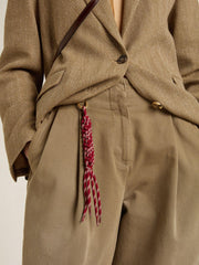 Charm with red knotted laces
