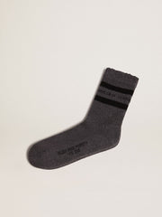 Grey socks with distressed details and black stripes