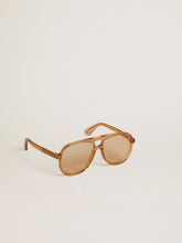 Aviator style sunglasses with honey-colored frame and lenses