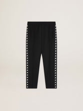 Men's black joggers with white stars on the sides