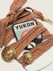 Skins burgundy and peach embroidered laces with patch and two charms