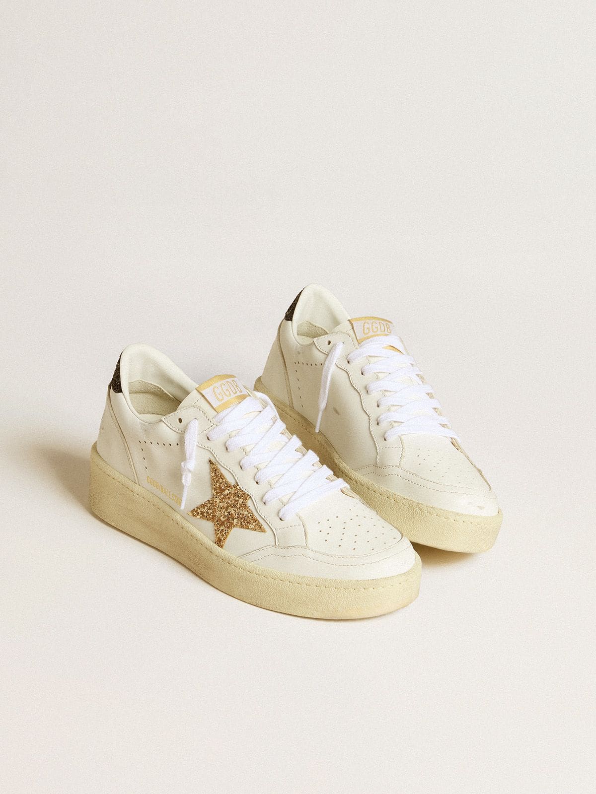 Women’s Ball Star in white leather with gold glitter star and black glitter heel tab