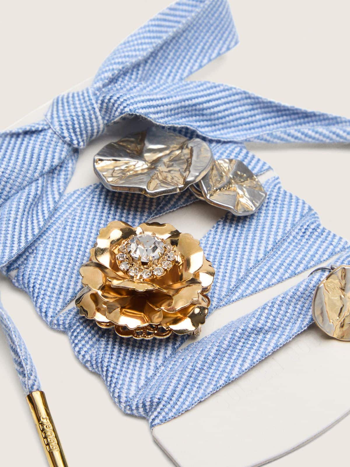 Skins light blue and white herringbone laces embellished with charms