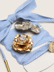 Skins light blue and white herringbone laces embellished with charms