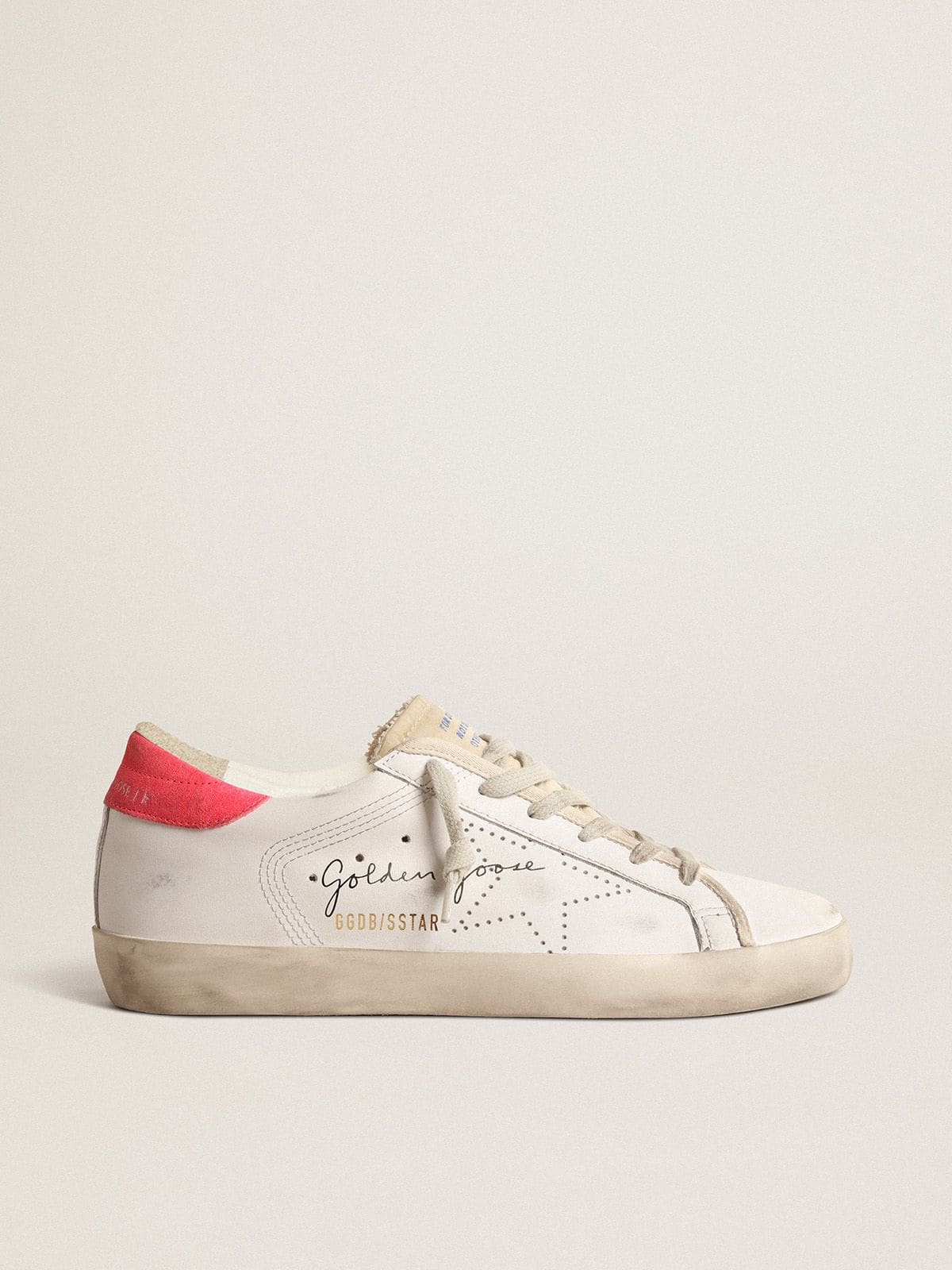 Women's white leather Super-Star with perforated star and fuchsia nylon heel tab