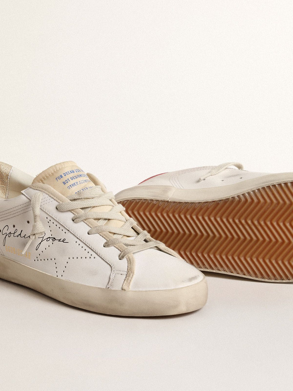 Women's white leather Super-Star with perforated star and fuchsia nylon heel tab