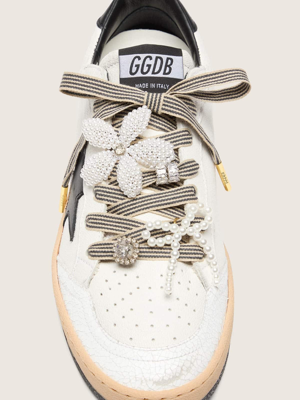 Skins black and beige striped laces with beaded and sparkling charms