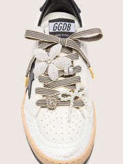 Skins black and beige striped laces with beaded and sparkling charms