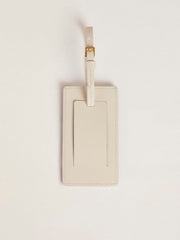 Worn white luggage tag