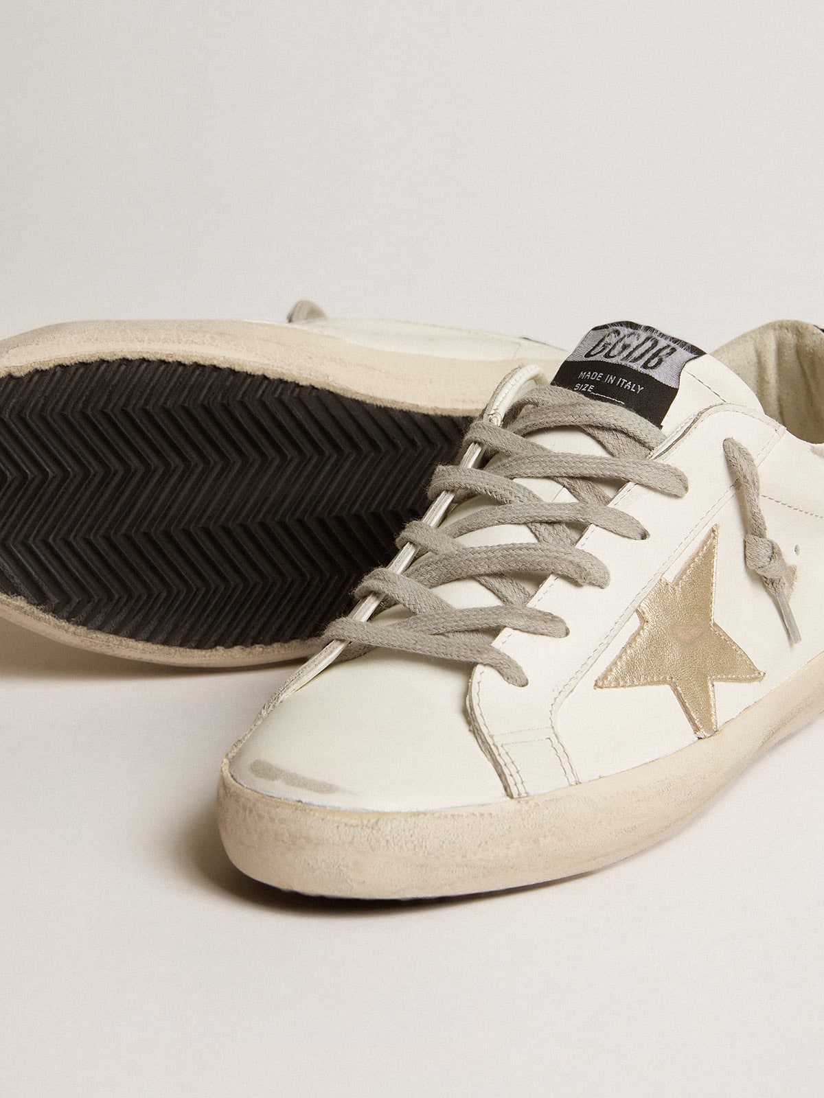 Women's Super-Star with gold star and black glitter heel tab