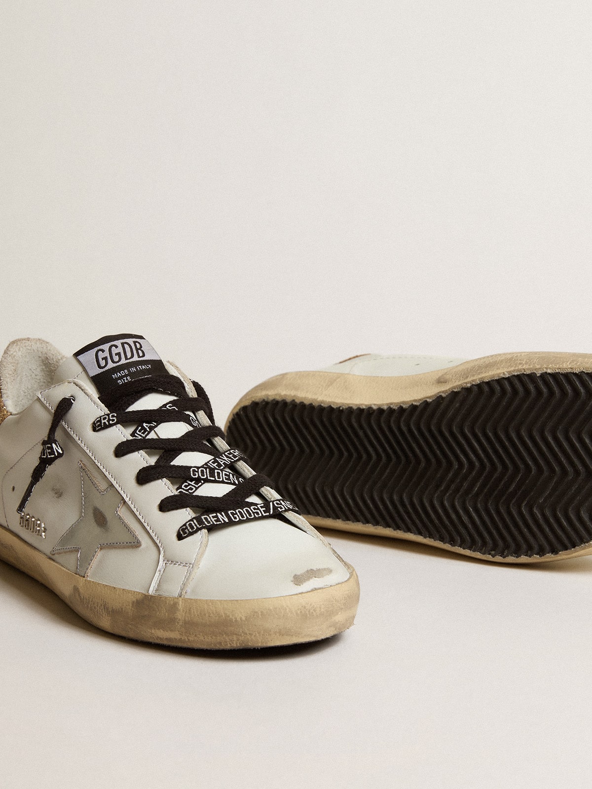 Women's white leather Super-Star with glittery heel tab