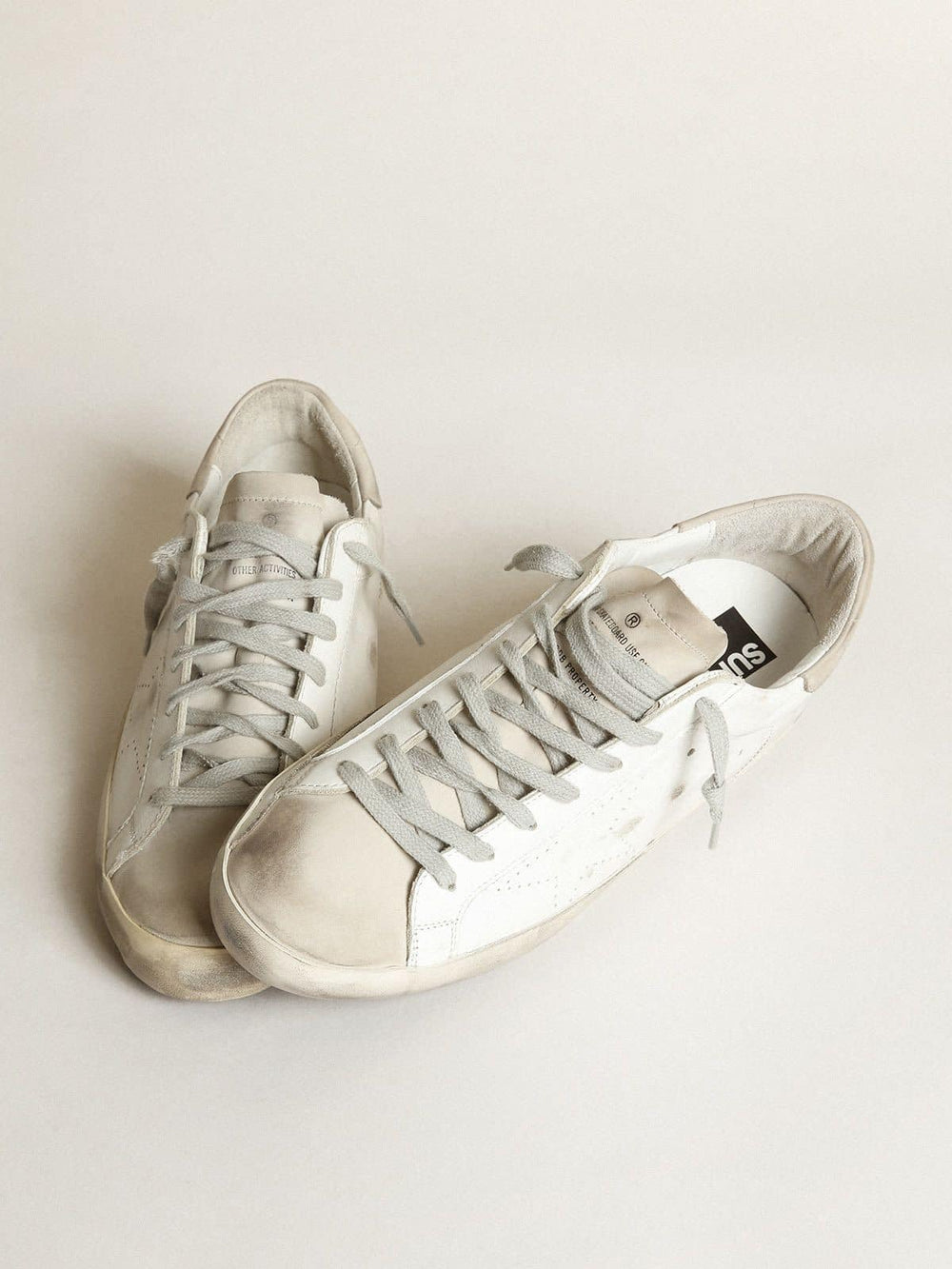 Women's Super-Star in white leather with perforated star and beige nubuck heel tab