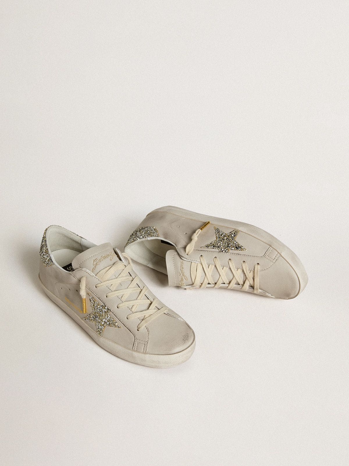 Women's Super-Star  in ivory nappa leather with platinum glitter star and heel tab