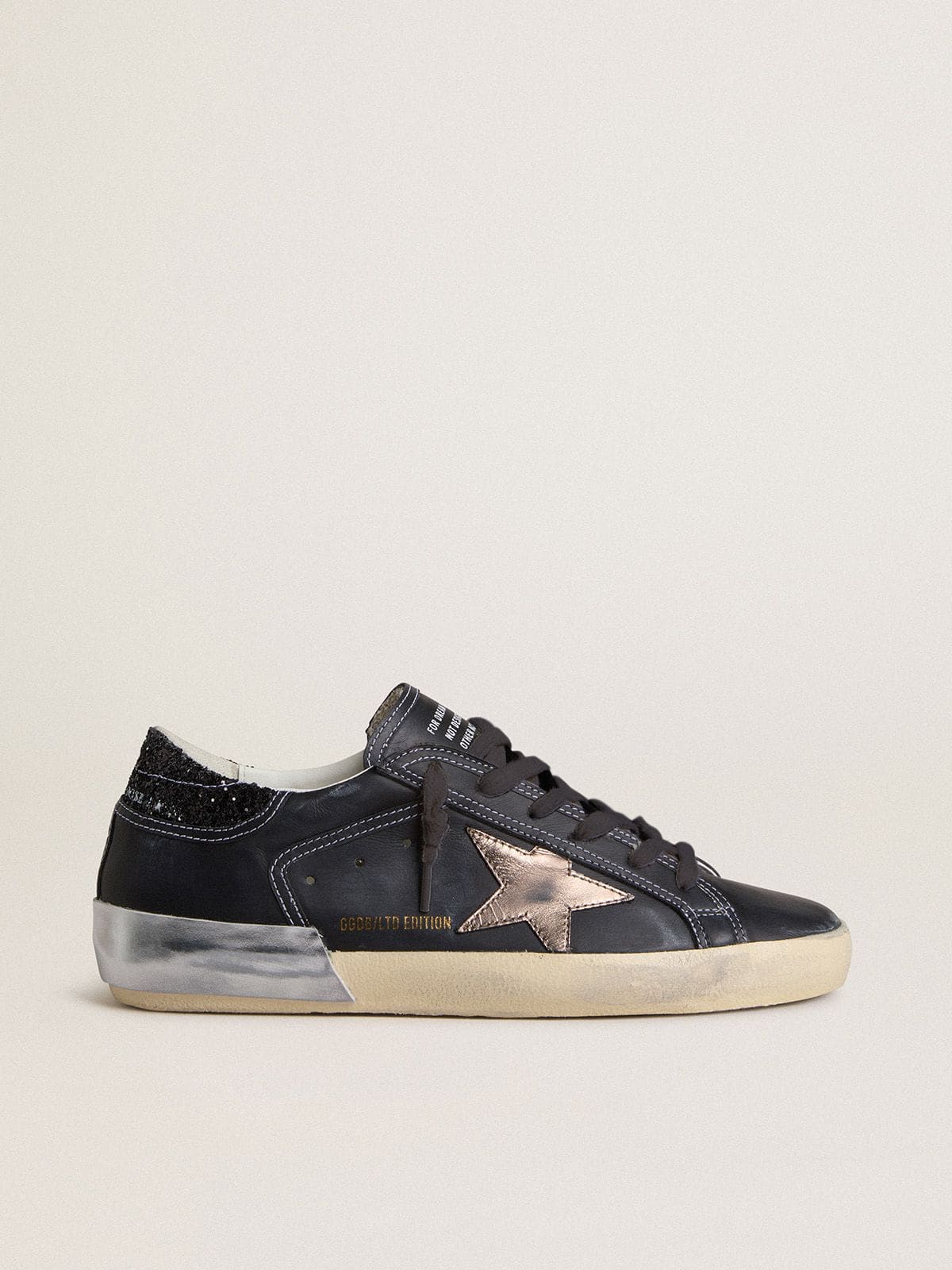 Women's Super-Star LTD in black leather with gold leather star and black glitter heel tab