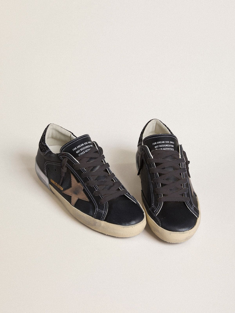 Women's Super-Star LTD in black leather with gold leather star and black glitter heel tab