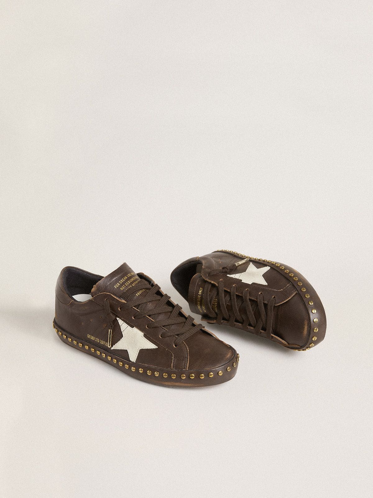 Women’s Super-Star LTD in dark brown leather with cream suede star and studs