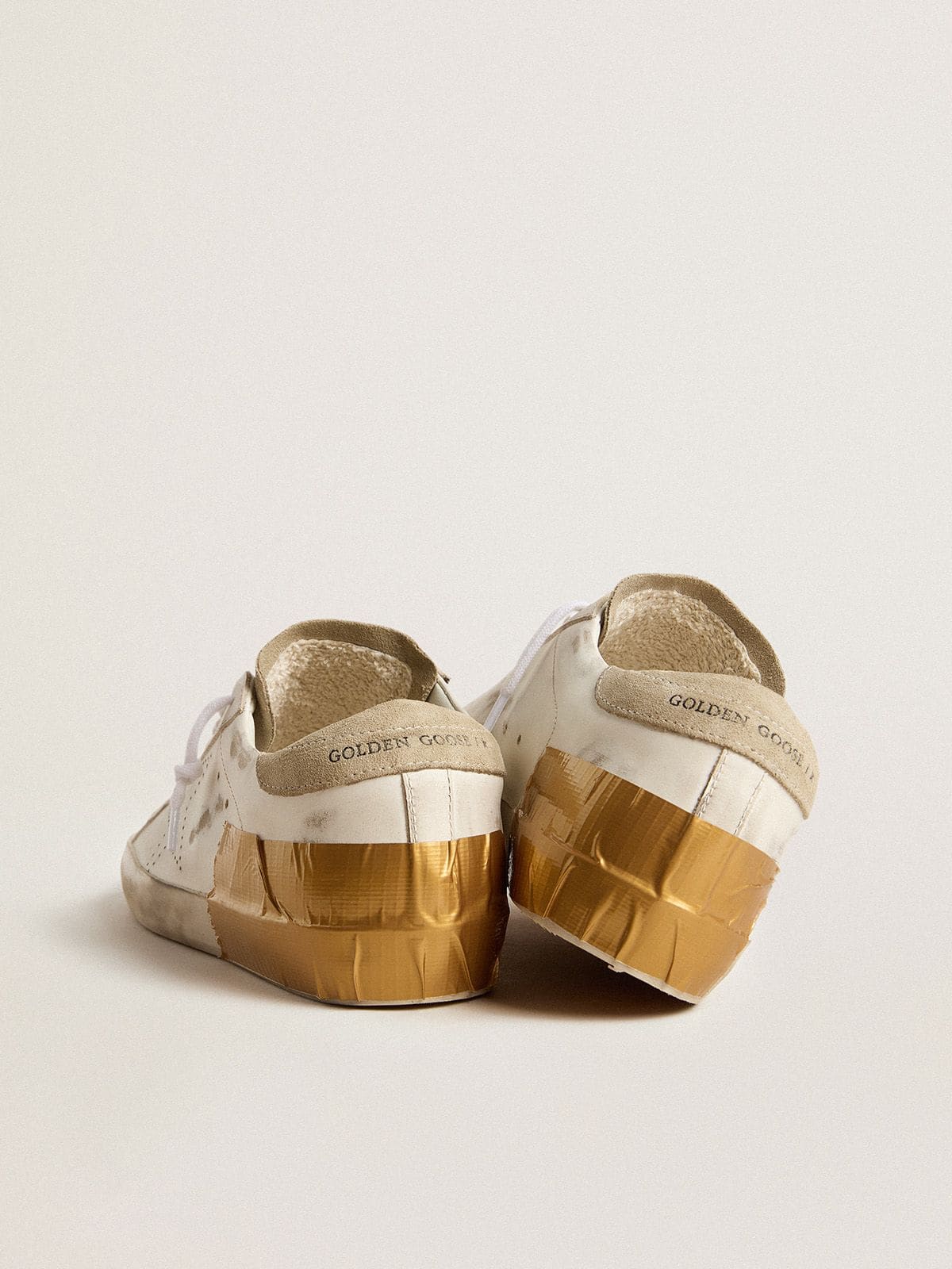Women's Super-Star LTD in white leather with ice-gray suede inserts and gold-colored tape
