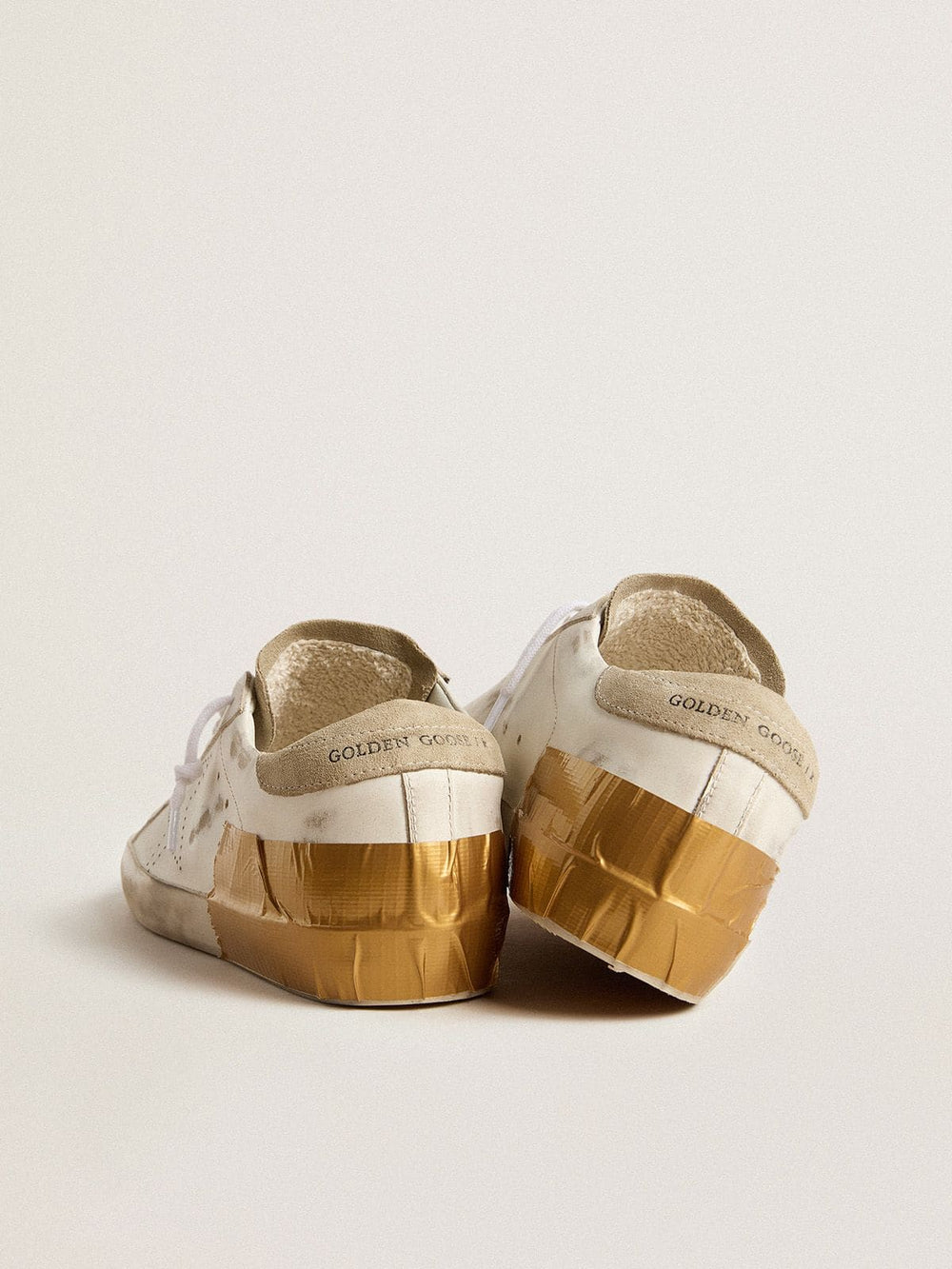 Women's Super-Star LTD in white leather with ice-gray suede inserts and gold-colored tape