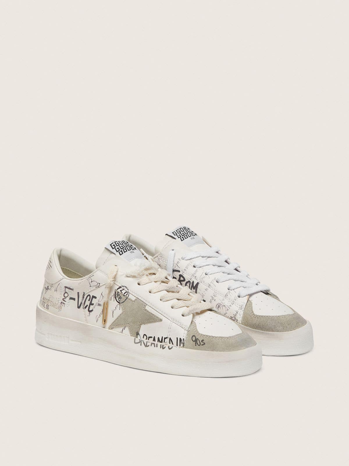 Stardan with beige suede star and toe and all-over lettering and patterns