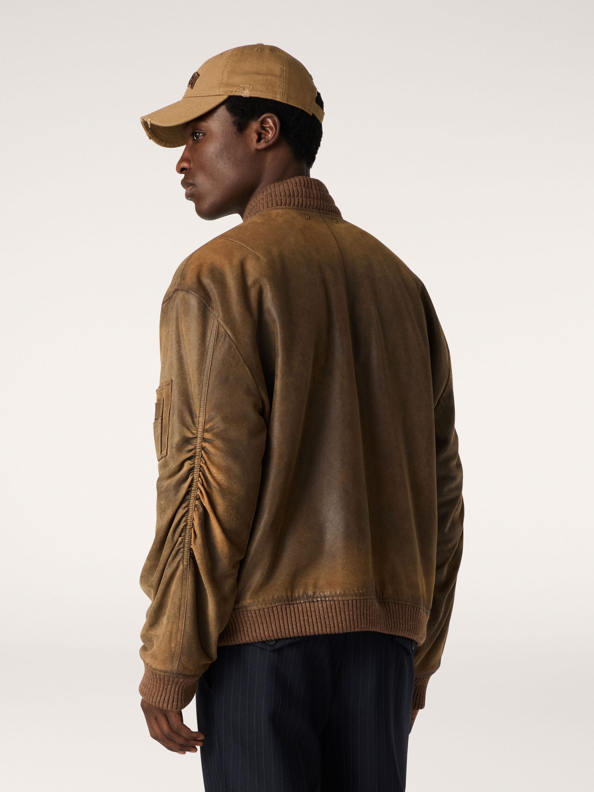 Brown leather biker jacket with a lived-in effect