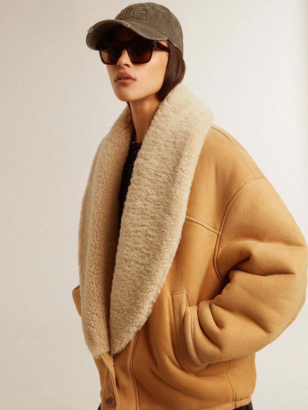 Women's sheepskin jacket with a wide shearling shawl collar