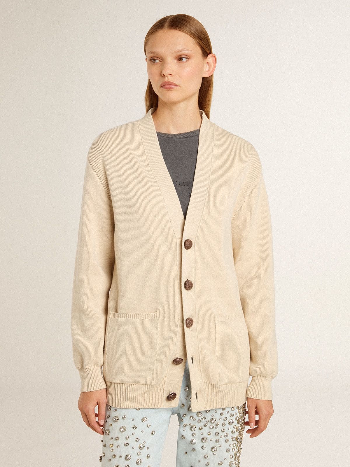 Women’s beige cardigan with 'Golden' lettering on the back