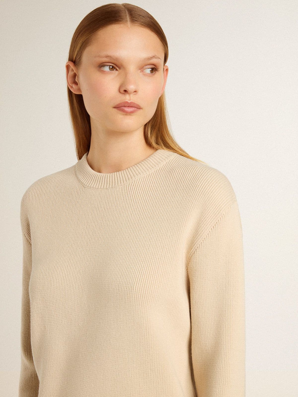 Women's beige sweater with 'Golden' lettering on the back