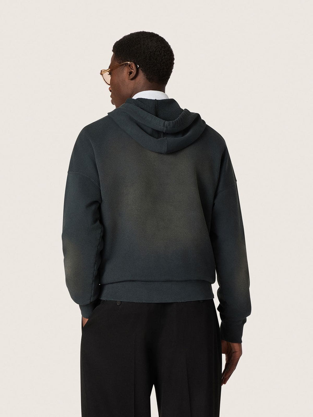Unisex hooded sweatshirt in black cotton with a bleached effect