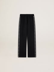 Women’s black joggers with white stars on the sides
