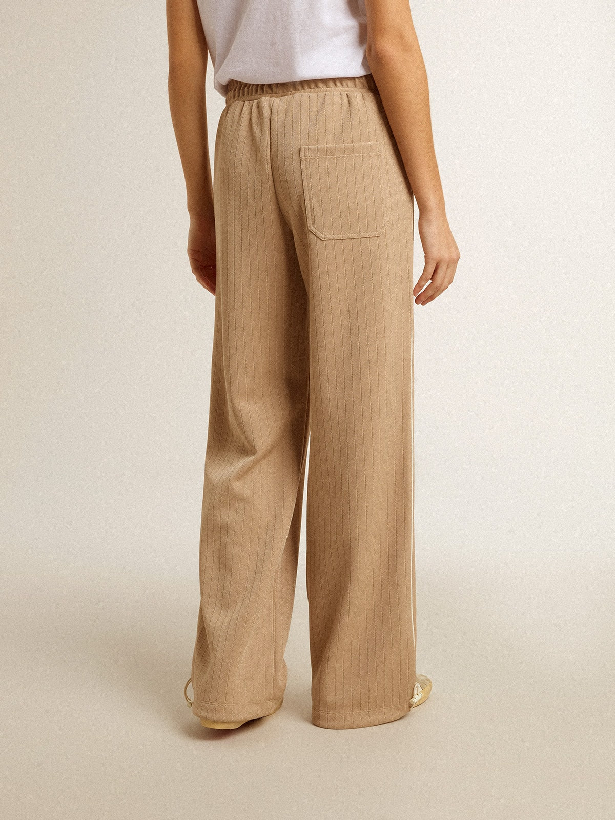 Women’s light beige joggers with white logo
