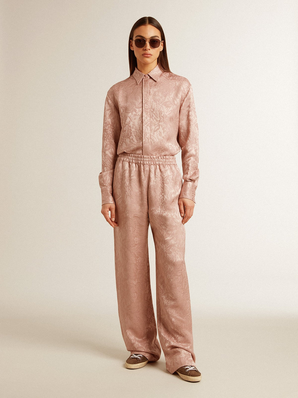 Women's pink viscose pants with floral pattern