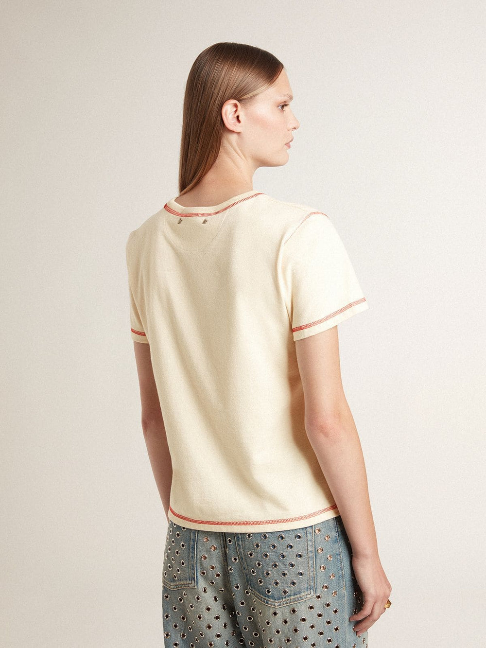 Women's cream T-shirt with faded red accents