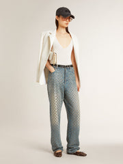 Sleeveless top embroidered with worn-white ribbing