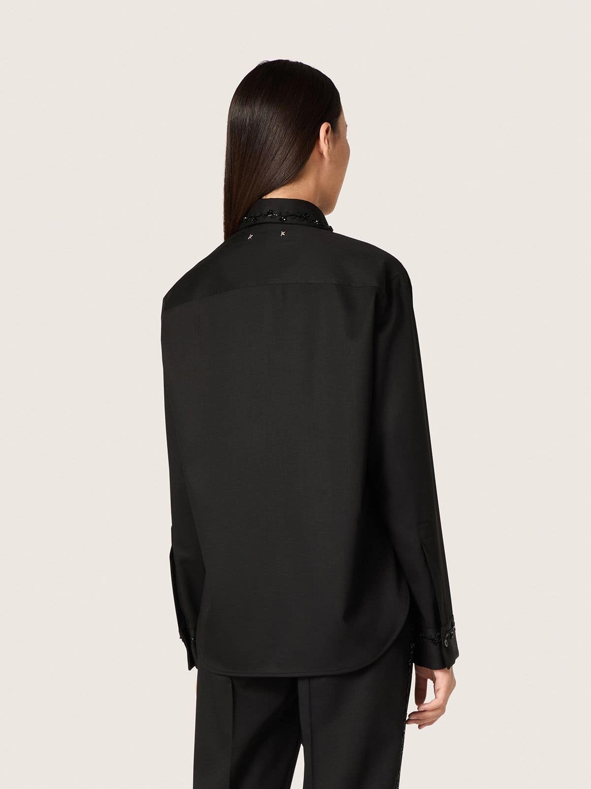Women's shirt in black wool twill with floral embroidery in glass beads