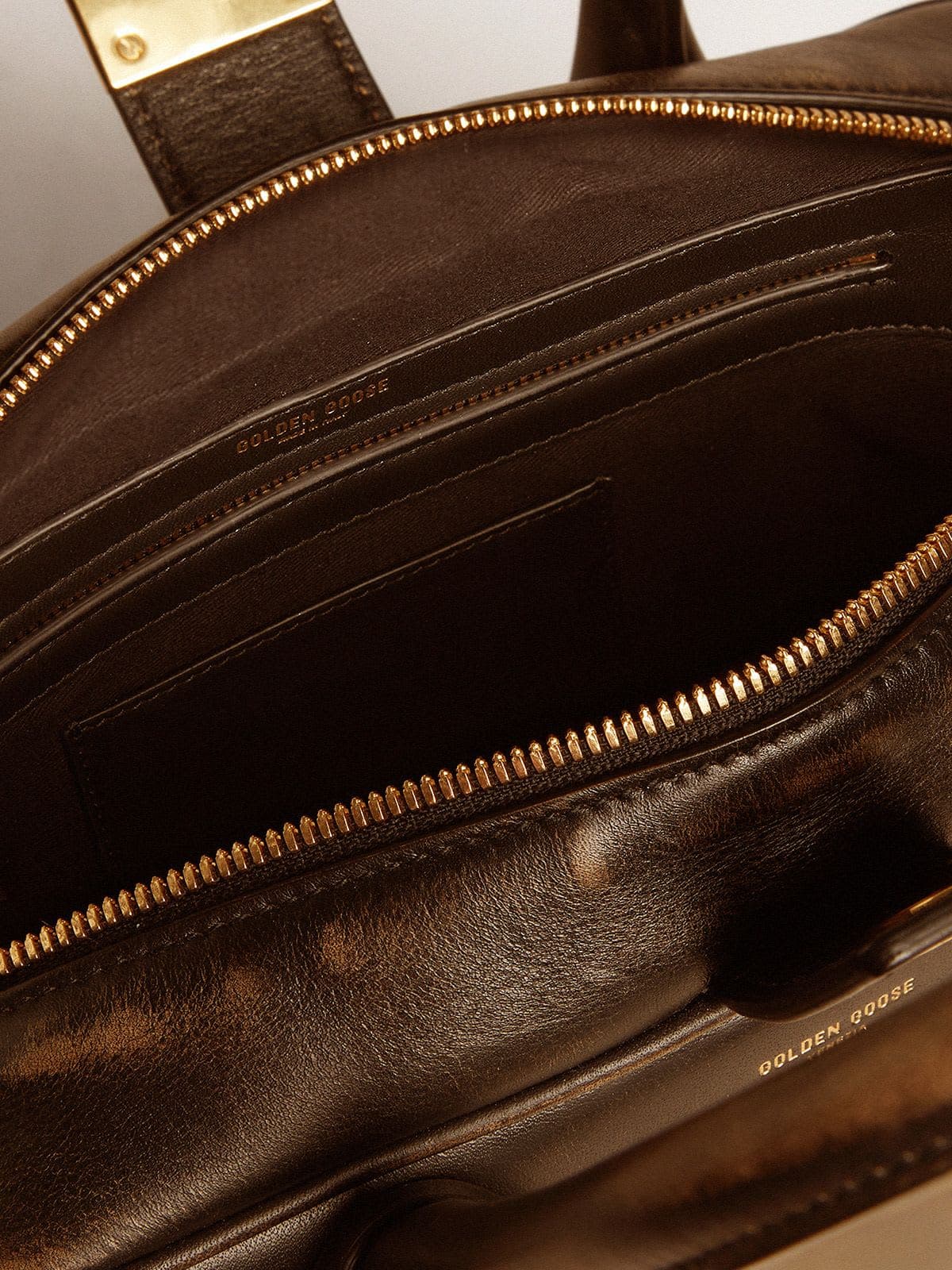 Vita Bag in black distressed leather with gold details