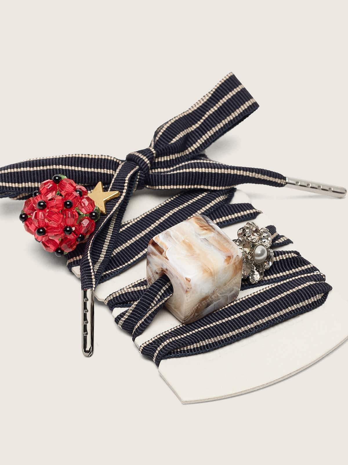 Skins blue and beige striped laces with raspberry, stone and crystal charms