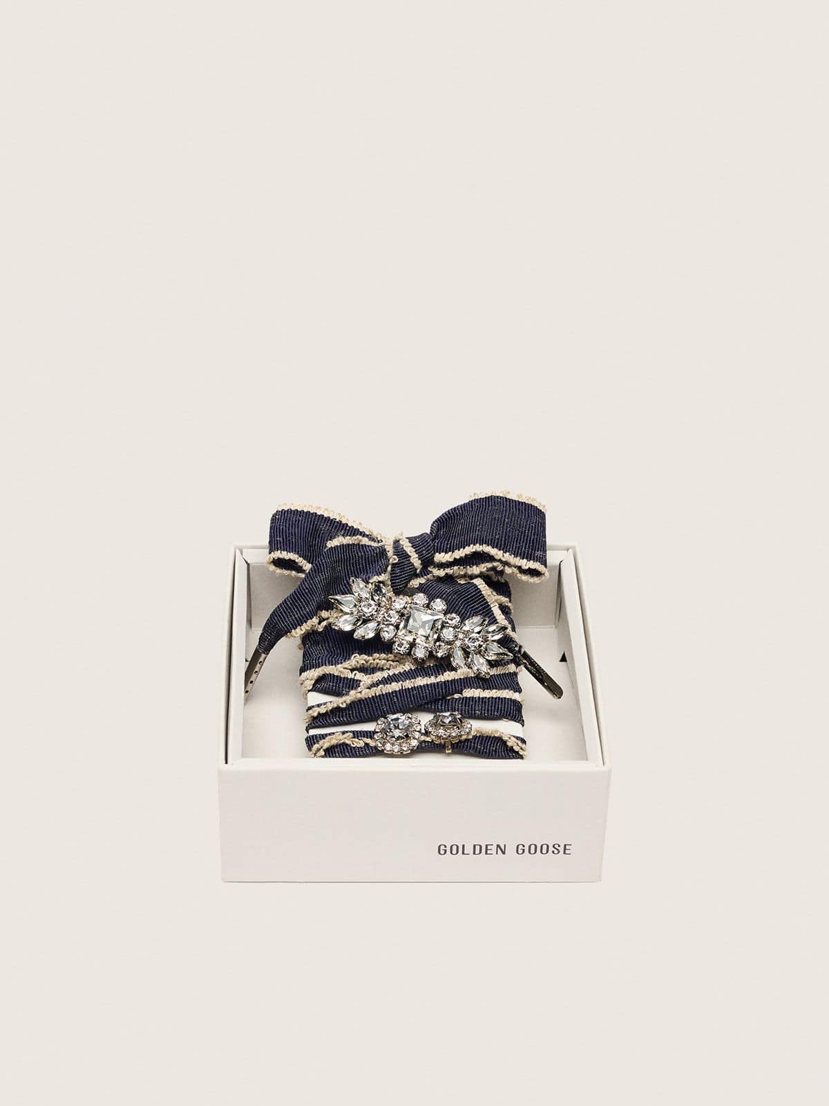 Skins denim blue laces embellished with beige trim and two charms