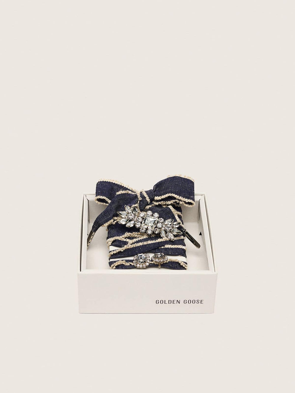Skins denim blue laces embellished with beige trim and two charms