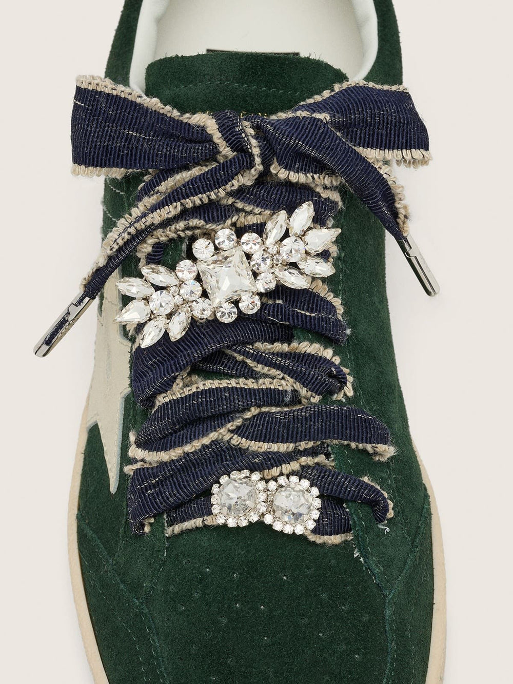 Skins denim blue laces embellished with beige trim and two charms