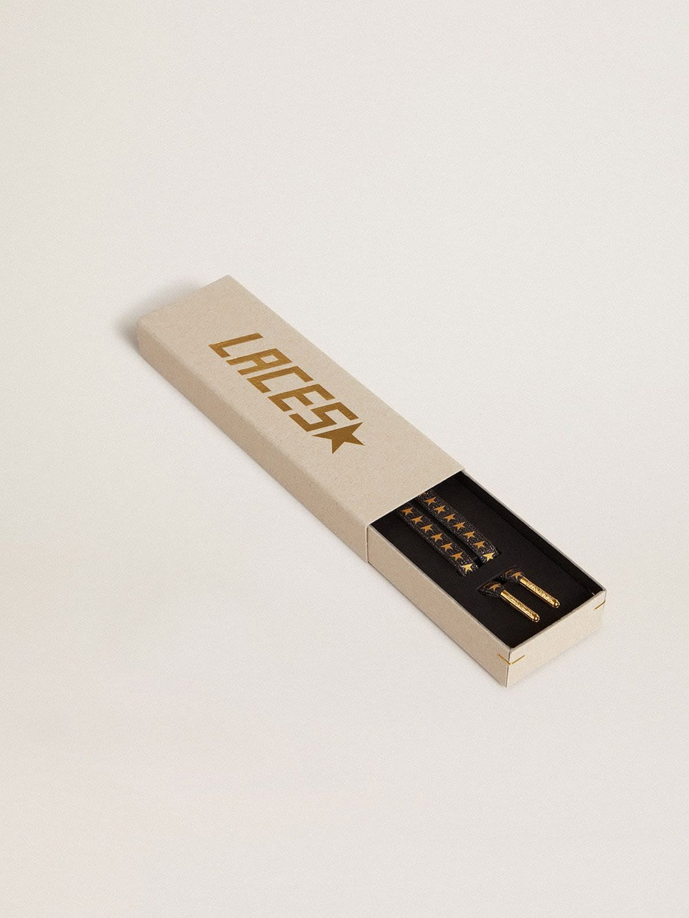 Dark gray Lurex laces with contrasting gold stars